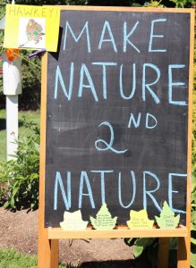 chalkboard reading "Make Nature 2nd Nature"